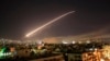 SYRIA – The Damascus sky lights up missile fire as the U.S. launches an attack on Syria targeting different parts of the capital early Saturday, April 14, 2018