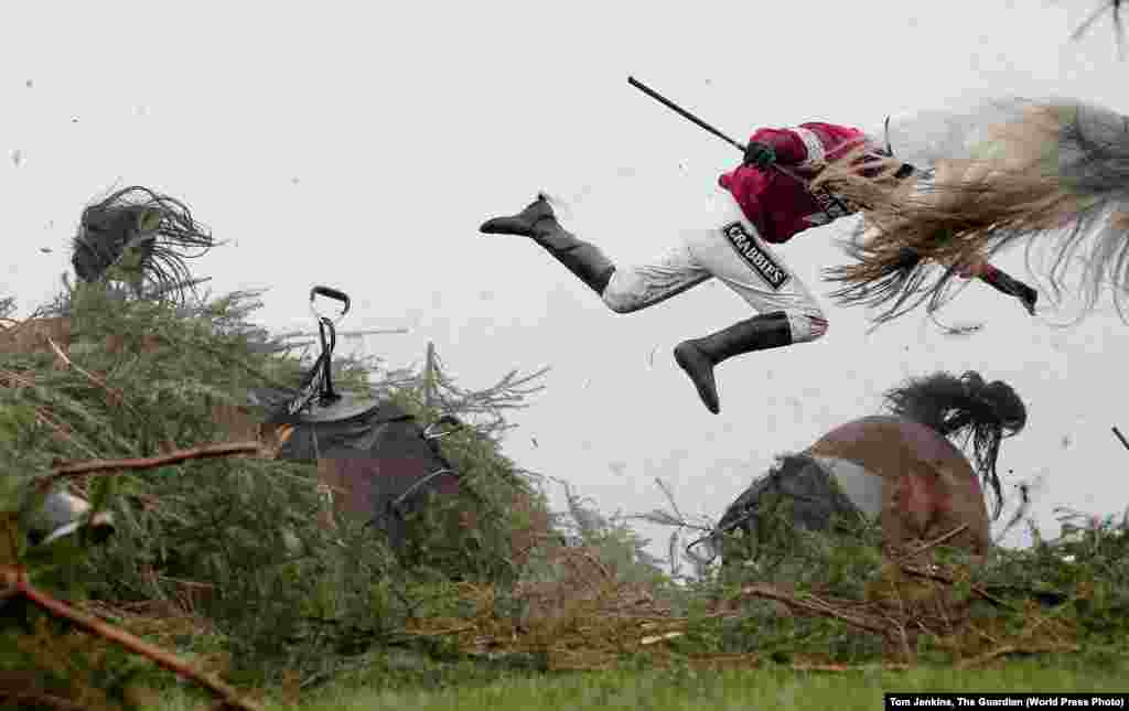 Jockey Nina Carberry flies off her horse Sir Des Champs at The Chair fence during the Grand National steeplechase at Aintree Racecourse, on April 9, 2016 in Liverpool, England. Sports -- First Prize, Singles (Tom Jenkins, The Guardian)