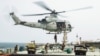 US marines board an Iranian-flagged vessel M/T Wen Bao in the Gulf of Oman as part of the US blockade of Iranian ports.