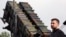 Ukrainian President Volodymyr Zelenskiy stands in front of a Patriot air-defense missile launcher in eastern Germany on June 11.