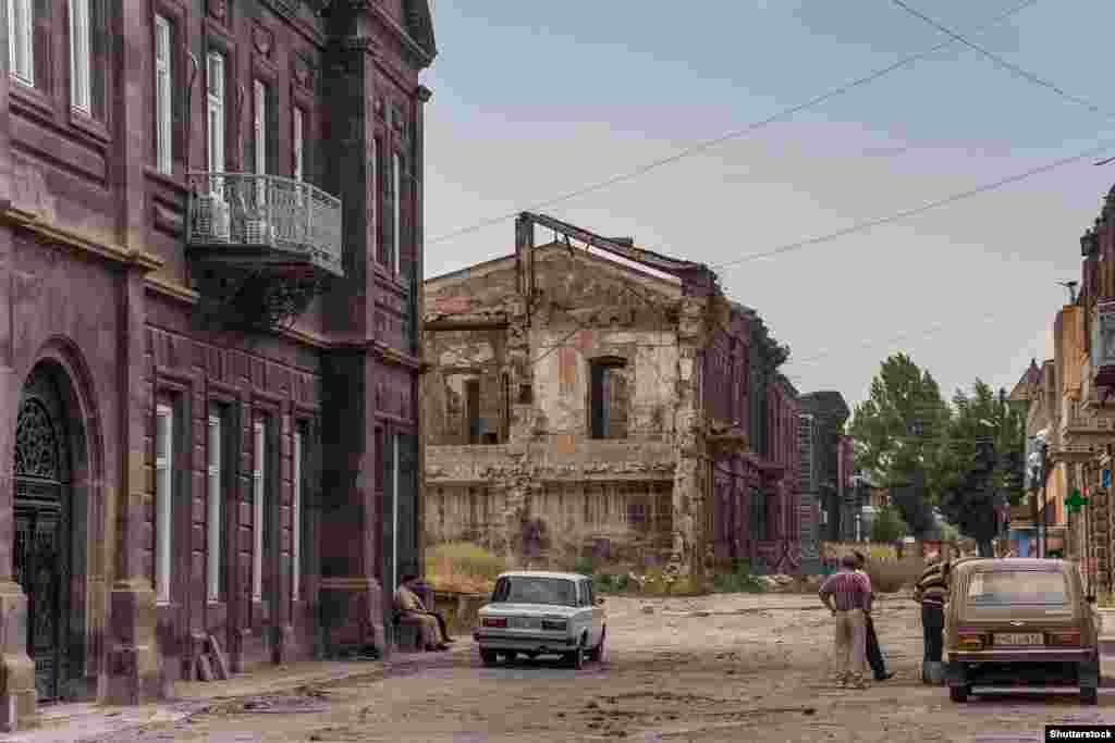 Earthquake-damaged buildings in Gyumri in 2013. Since the quake, which destroyed most of the town&#39;s factories, the population has nearly halved. For quake survivors and many other Armenians, the lure of a job in neighboring Russia is strong. One Gyumri local told a reporter in 2013 that &quot;unemployment and poverty are more terrifying&quot; than the prospect of another earthquake.