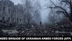 A Ukrainian soldier walks next to destroyed buildings in the frontline town of Kostyantynivka on November 28.