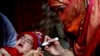 A health worker marks a child's finger after administering a polio vaccination in Lahore on January 11.