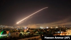 The Damascus sky lights up with missile fire as the United States, Britain, and France launched air raids last April after an alleged chemical attack.