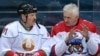 Russian oligarch Gennady Timchenko (right) speaks with Belarusian strongman Alyaksandr Lukashenka during an ice hockey game at Shayba Arena in Sochi, Russia, in 2019. 