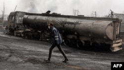 A destroyed fuel tanker following an overnight air strike on the Shahran oil refinery in northwestern Tehran, pictured on March 8