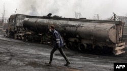 A destroyed fuel tanker following an overnight air strike on the Shahran oil refinery in northwestern Tehran, pictured on March 8