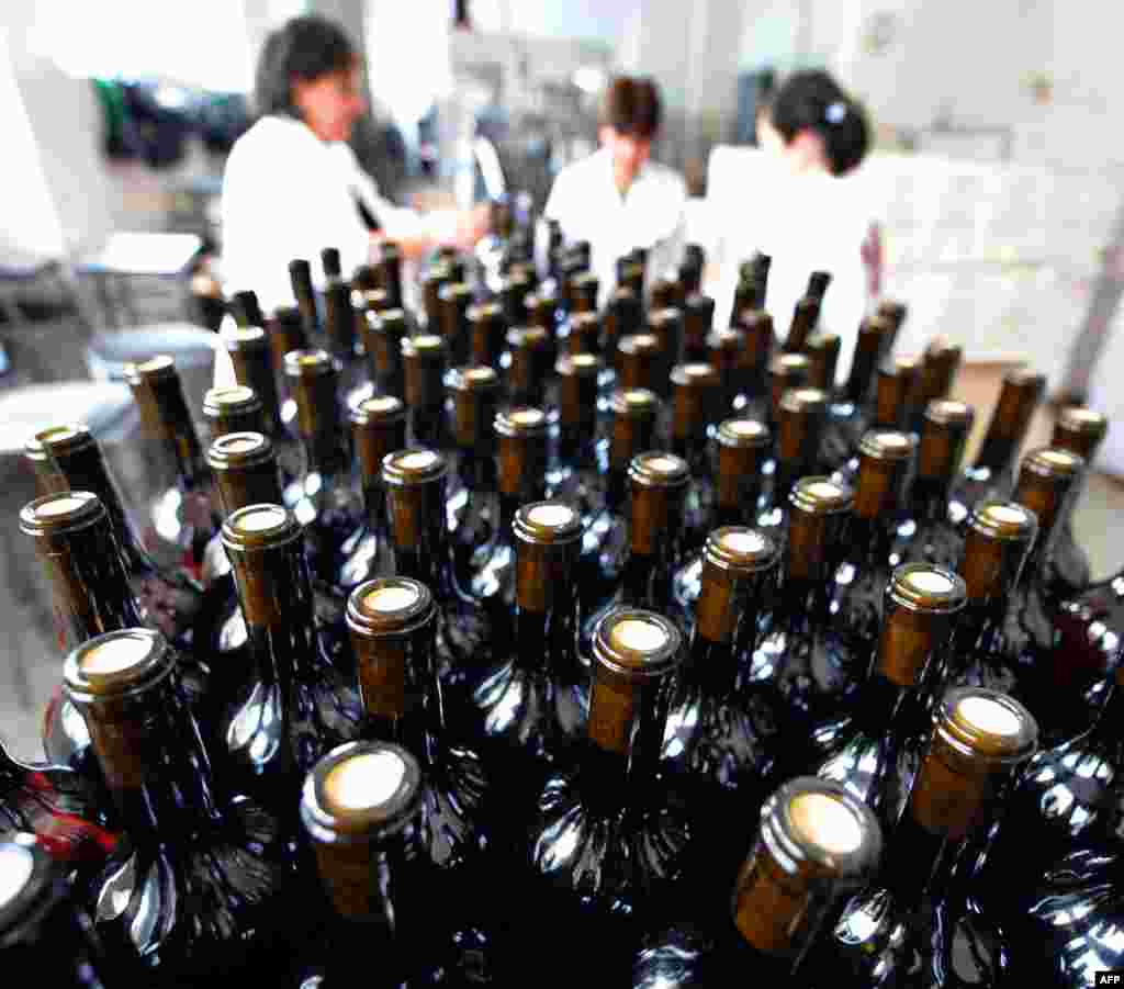 Bottles move along a conveyor belt at a wine factory in Lilo near Tbilisi, Georgia. The first batch of Georgian wine has been allowed back into Russia seven years after Moscow slapped a ban on Georgian wines amid spiralling tensions that eventually erupted into a brief war in 2008. (AFP/Vano Shlamov)