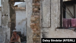 A construction worker taking a break at the house of Maya Tosunbekova, a Kyrgyz resident of the Cheremushki district of Osh in southern Kyrgyzstan.