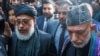Экс-президент Афганистана Хамид Карзай (справа) и глава делегации талибов Аббас Станикзай на встрече в Москве