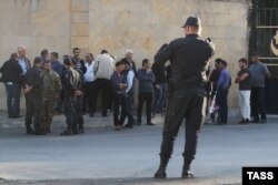 The relatives of wounded or missing soldiers wait outside an army hospital in Baku last month.