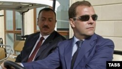 Azerbaijani President Ilham Aliyev (left) with his Russian counterpart, Dmitry Medvedev, in Baku on June 29