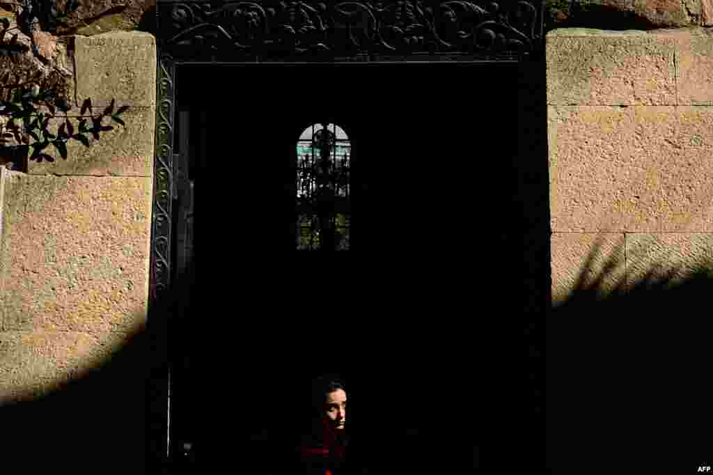 A woman leaves the sixth-century Anchiskhati Basilica in the old city in central Tbilisi, Georgia. (AFP/Kirill Kudryavtsev)