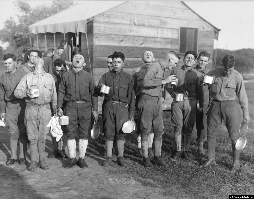 Men at a U.S. military base gargling with salt water -- one of many questionable &quot;preventative measures&quot; advised to stop the virus&#39;s spread.