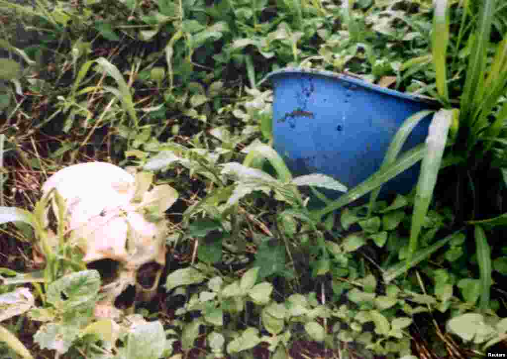 A human skull next to a United Nations helmet found in Sierra Leone. The UN peacekeeping operation in the country ran from 1999 to 2005 and its mission mandate was notable for allowing troops to protect civilians under imminent threat of physical violence. 