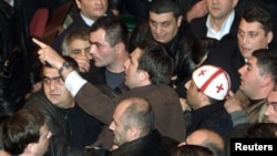Saakashvili as an opposition leader, giving instructions to his supporters in the Georgian parliament in November 2003
