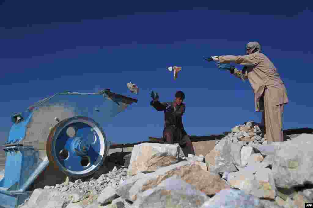 Afghan laborers work at a marble stone factory on the outskirts of Ghazni.