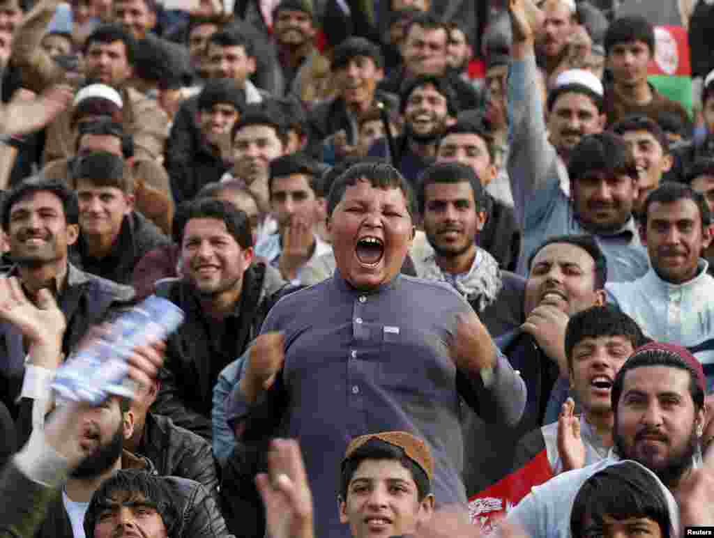 Afghan cricket fans welcome Afghanistan's national cricket team back to Kabul after a stellar performance in the Twenty20 World Cup tournament. (Reuters/Omar Sobhani)