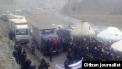 Supporters of former parliament speaker Akmatbek Keldibekov block the international highway to China.