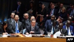 Chinese Foreign Minister Wang Yi speaks at the United Nations Security Council meeting on North Korea, September 27, 2018 at the United Nations in New York. US Secretary of State Mike Pompeo warned Thursday that sanctions against North Korea must be "vigo