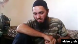 Screen grab from video showing the Daghestani Islamic State militant Abu Hanif.