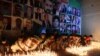 Residents place candles at the site during a vigil to pay tribute to victims a day after a suicide bombing at the Civil Hospital in Quetta on August 9.