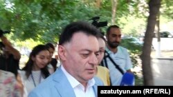 Armenia -- Judge David Grigorian is approached by journalists, Yerevan, July 19, 2019. 