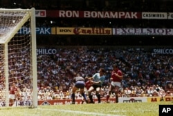 Uruguay (in light blue) and the Soviet Union (in red) play in World Cup quarterfinal action in Mexico City on June 14, 1970. Uruguay won in overtime.