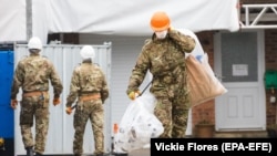 U.K. military personnel at the house of former Russian spy Sergei Skripal in Salisbury, England, on February 4, 2019