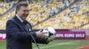 Ukrainian President Viktor Yanukovych plays around in Kyiv's Olympic Stadium, one of the scheduled venues for Euro 2012.