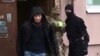 Russian FSB agents detain an unidentified suspect they said belonged to an Islamic State sleeper cell in Yaroslavl on May 4.