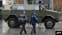 A military vehicle and police in front of the Central Railways station in Brussels on November 21