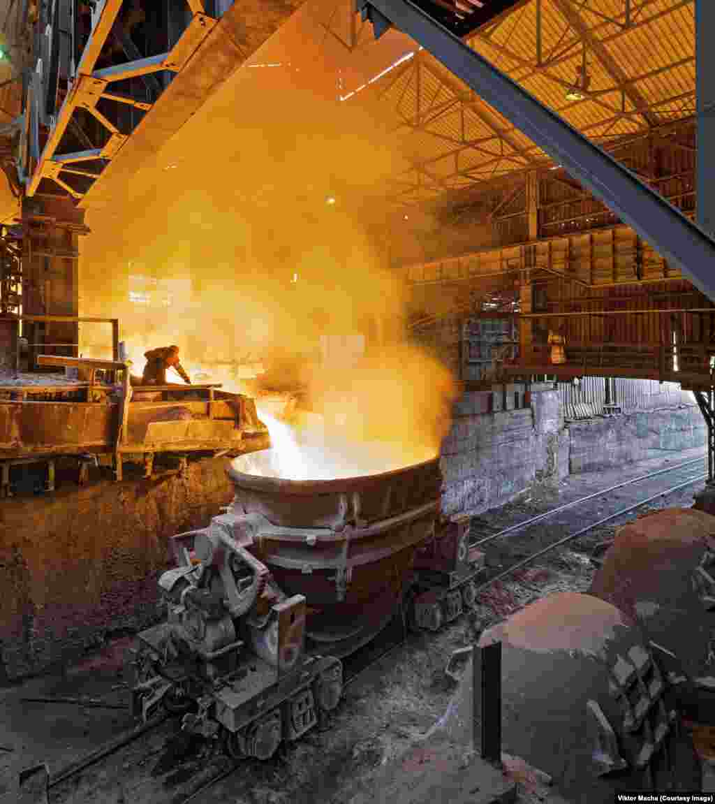 A worker directing slag into a ladle in Satka, Russia. &quot;I want to have something to show my kids after this world has disappeared,&quot; Macha says.