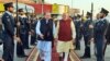 Indian Prime Minister Narendra Modi (C-R) being welcomed by the Prime Minister of Pakistan, Nawaz Sharif (C-L), at the airport in Lahore on December 25. 