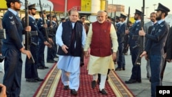 Indian Prime Minister Narendra Modi, center right, being welcomed by the prime minister of Pakistan, Nawaz Sharif at the airport in Lahore, Pakistan, in December 2015. 
