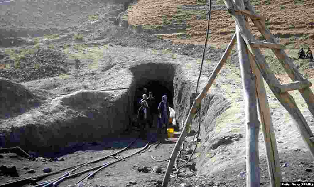 The dead bodies of Afghan miners are brought out of the coal mine.