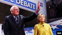 Bernie Sanders (left) acknowledged that Hillary Clinton (right), his rival for the Democratic U.S. presidential nomination, had won the necessary delegates to be their party's choice for the election. (file photo)