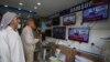 FILE: Pakistani viewers watch news bulletins on television in Karachi.