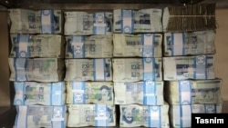 Stacks of Iranian rial banknotes.