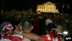 People celebrate the announcement of the death of Osama bin Laden at the White House in Washington.