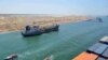 FILE - A cargo ship is seen crossing through the New Suez Canal, Ismailia, Egypt, in this July 25, 2015. 