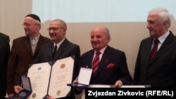 Dervo Sejdic (second from left) and Jakob Finci (second from right) receive an award from the International League of Humanists in Sarajevo in January 2013