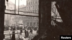 Hungarians walk on the streets of Budapest during the 1956 uprising against the Soviet-supported Hungarian communist regime.