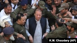 Pakistani former Prime Minister Nawaz Sharif arrives at a court in Lahore on October 11.