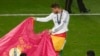 Portugal - Real Madrid's Sergio Ramos performs a bull fight as he celebrates after defeating Atletico Madrid in their Champions League final soccer match at the Luz Stadium in Lisbon May 24, 2014.