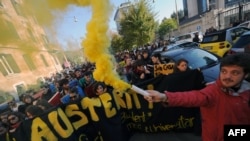 Italian students march during a demonstration in Rome against unpopular austerity cuts.