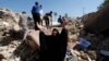 A woman reacts at the site of a suicide bomb attack on Shi'ite mosque in Mussayab, south of Baghdad, on September 30.