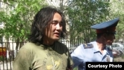 Kazakh opposition activist Aidos Sadyqov is arrested in Aqtobe in July 2010.