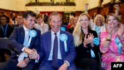 Brexit Party leader Nigel Farage (second from left) celebrates his party's strong showing in EU elections in the United Kingdom. 