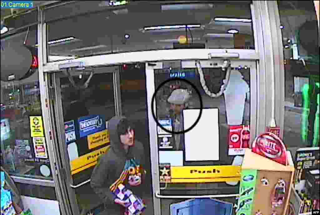 A video grab used as prosecution evidence shows Tamerlan Tsarnaev (right) and Dzhokhar Tsarnaev (left) entering a Shell station in Cambridge, Massachusetts, on April 15, 2013, the day of the bombing attacks.